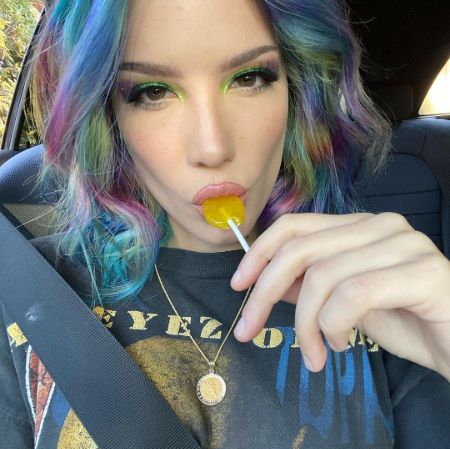 Halsey also shared another selfie showing that she was wearing a black Tupac Shakur t-shirt from his 1996 album 'All Eyez on Me,' while sucking on a lollipop.